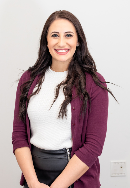 Woman in Purple Cardigan Smiling